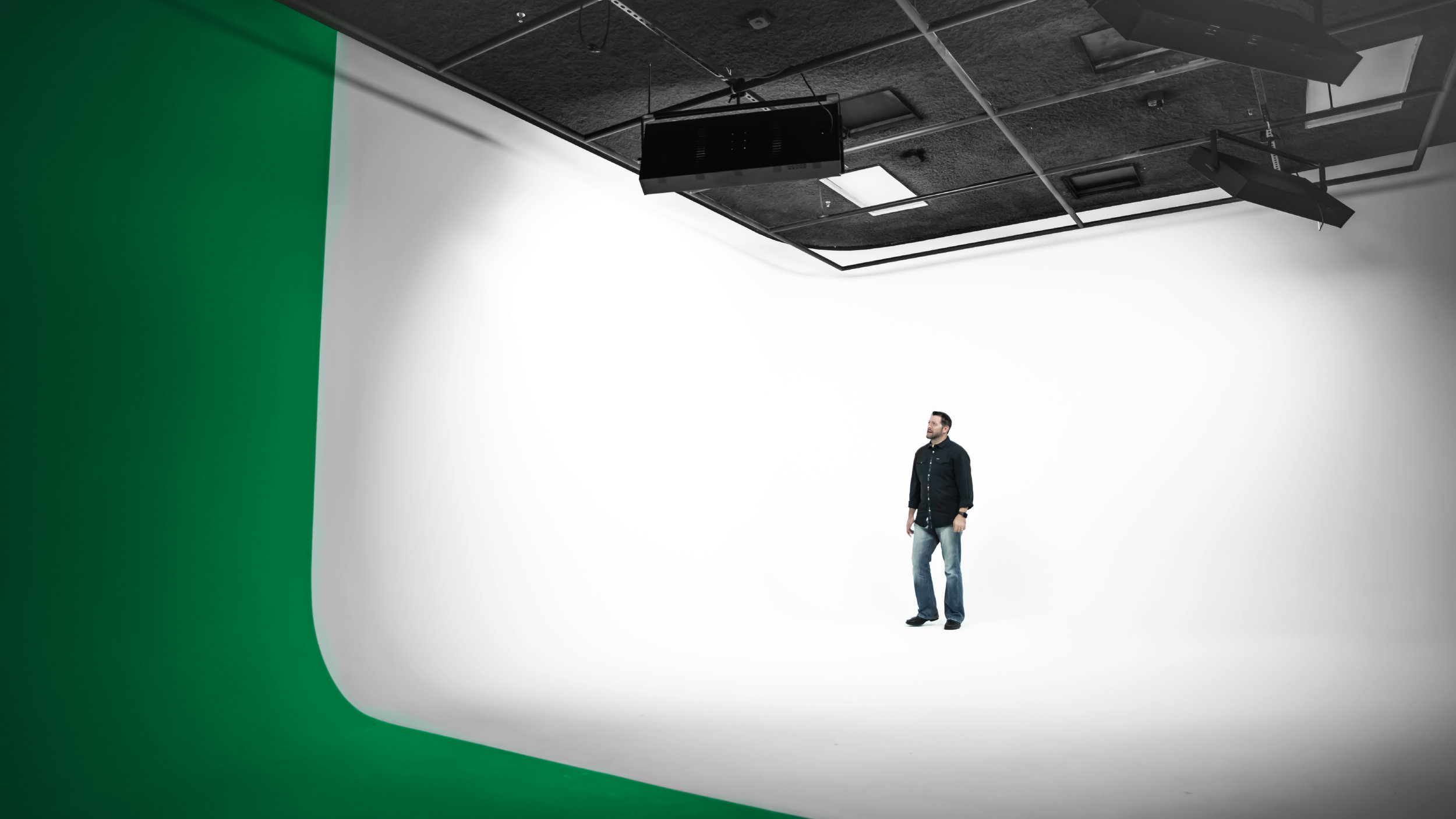 Person standing in empty video production studio